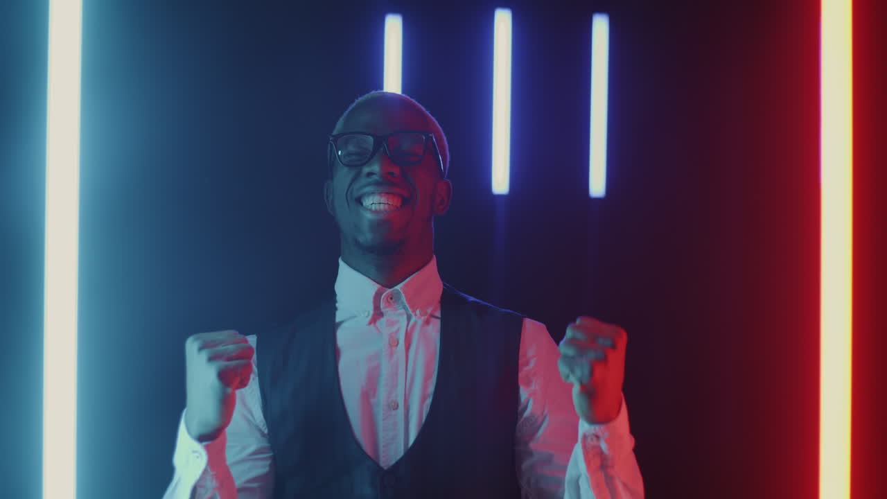 Happy Man Celebrating in Neon Light