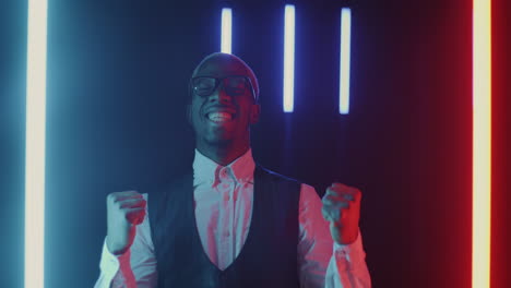 happy man celebrating in neon light