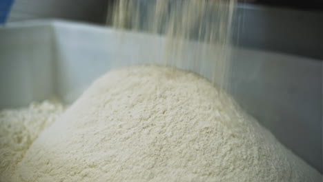 flour pouring into container