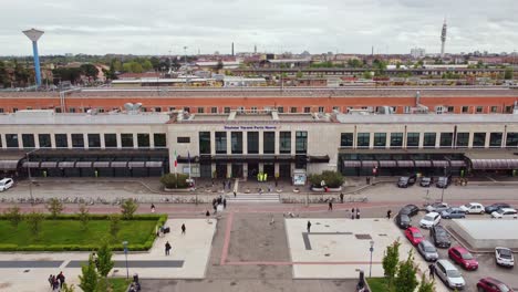 modern railway station in verona, italy with wide view of surrounding area and vehicles