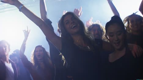 group of people dancing at a concert 4k