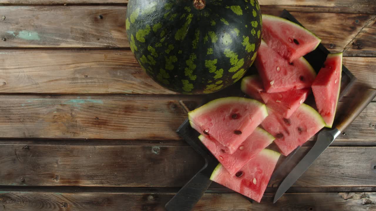 Sliced on a cutting Board watermelon with cool steam.