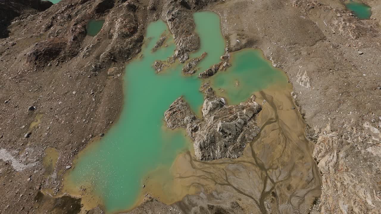 Green glacial lakes and perennial glaciers at Cima Fontana, Bernina mountains during summer season, Valmalenco in Italy