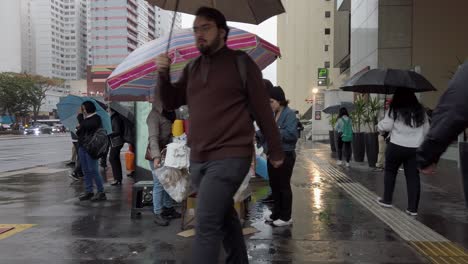 street vendors rainy weather in a bustling city during late afternoon, showcasing local snacks and drinks. são paulo, brazil