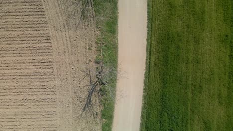 Aerial-birds-eye-flying-backwards-over-countryside