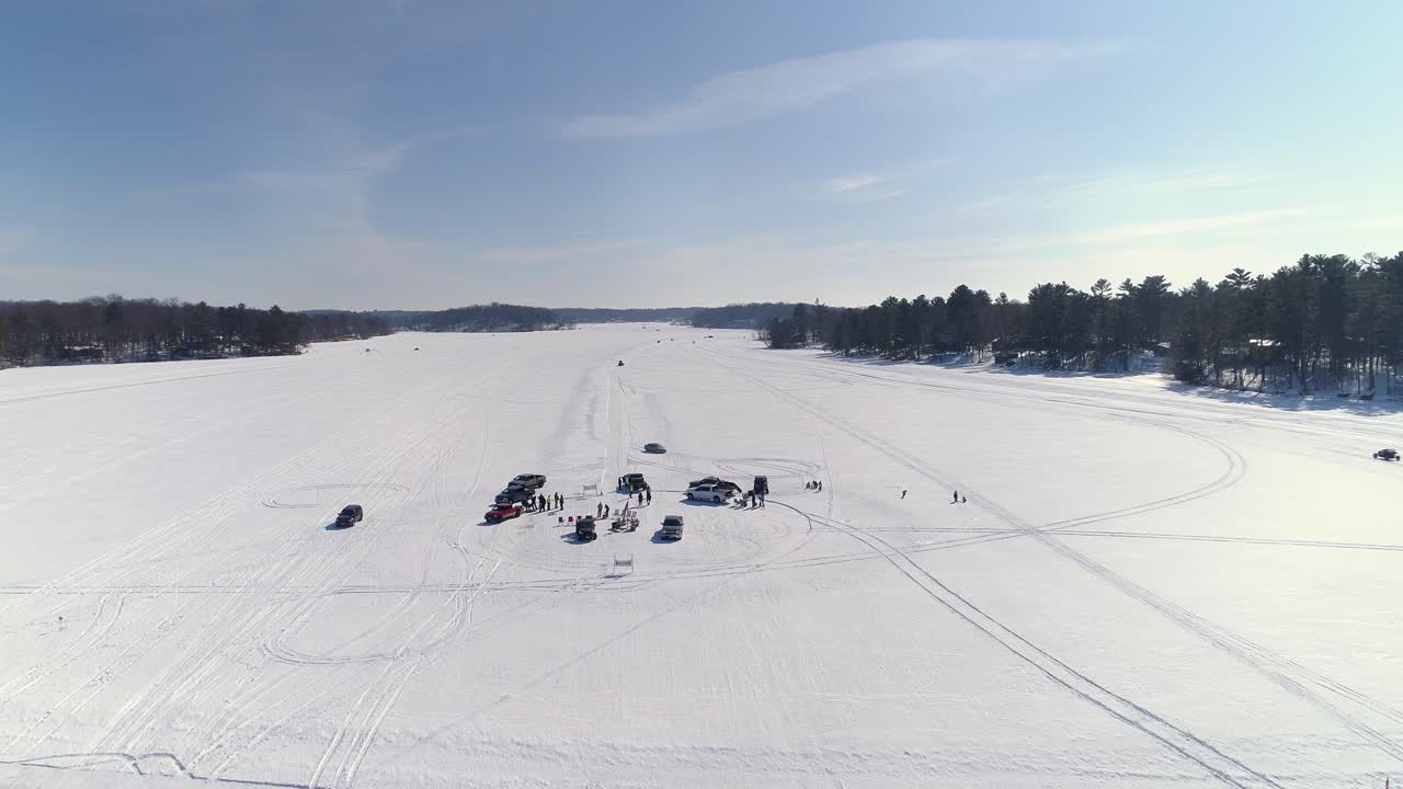 Ascending aerial view over a winter race course for specialized utility vehicles