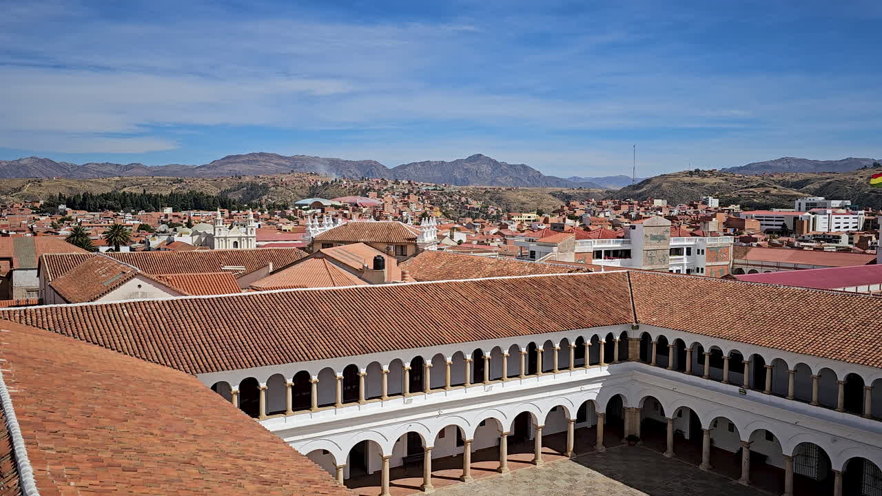 Explore the timeless beauty of Sucre, Bolivia, through its colonial architecture. This video showcases the city's historic terracotta rooftops set against a stunning backdrop of the Andean