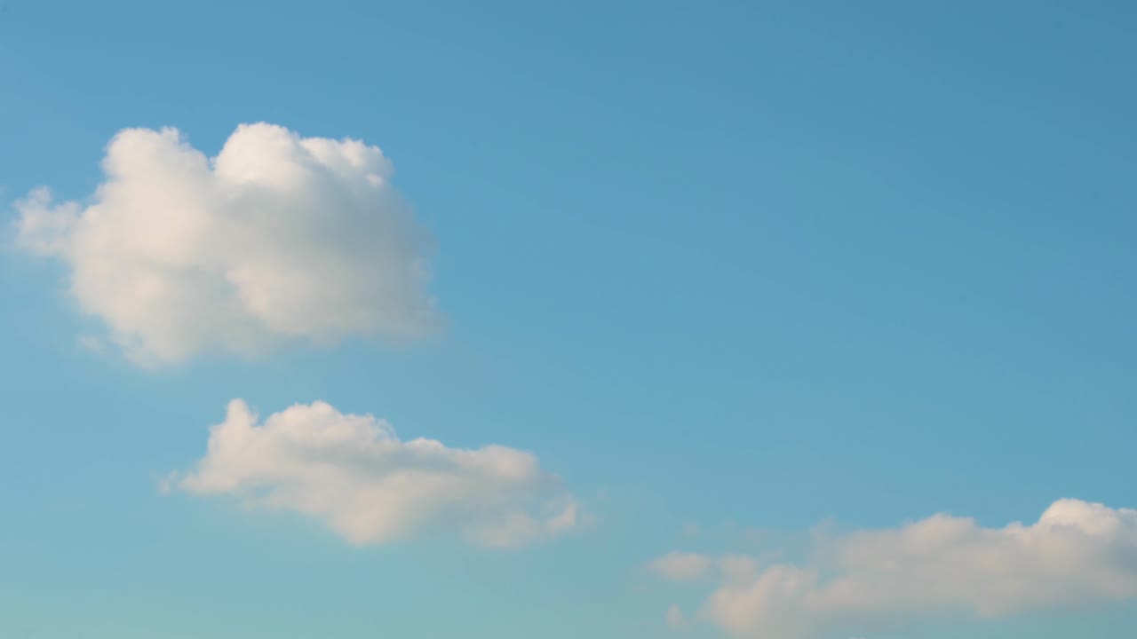 Landscape view of a blue and clear sky and white clouds.