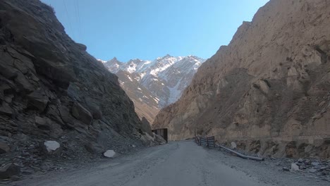 point of view driving on a dangerous and broken mountain road