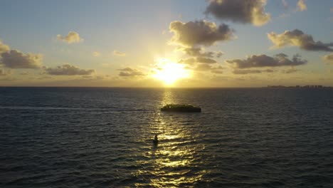 drone flies backward as boat moves across frame