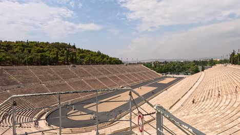 historic stadium with olympic rings in athens