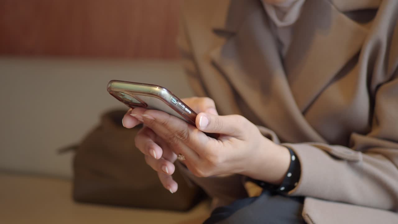 Close Up of Woman's Hands Using a Smartphone