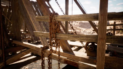 rustic wooden structure with chains and intricate details in a canyon setting