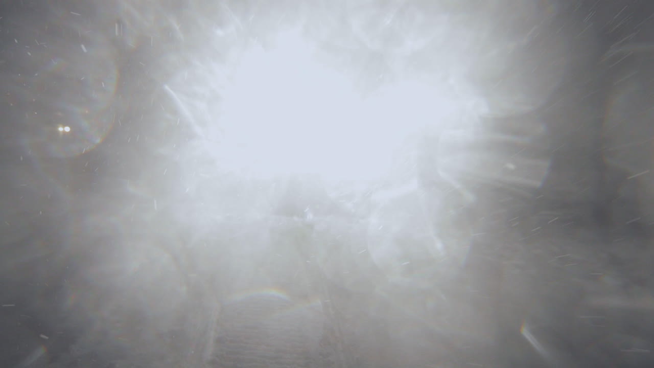 Half-track driving in the night in Jotunheimen in Norway. The half-track has skies in front. Its night and the snow are falling. Filmed on a gimbal in 4k.