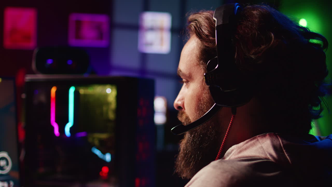 Gamer chatting with internet friends while enjoying SF game, close up