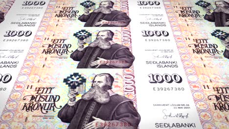 banknotes of one thousand kroner or crowns of iceland rolling, cash money