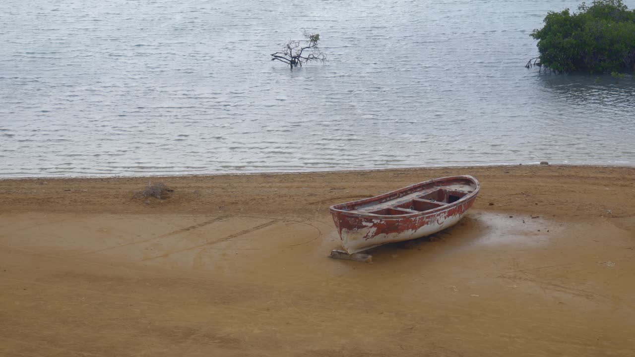 Water lake La Guajira peninsula desert Colombia remote isolated abandoned fishing boat