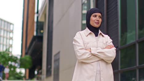 Portrait-Of-Modern-Muslim-Businesswoman-Wearing-Hijab-With-Business-Suit-Going-To-Work-Standing-Outside-Office-Building-With-Folded-Arms-1