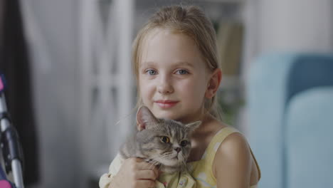 girl holding a cat