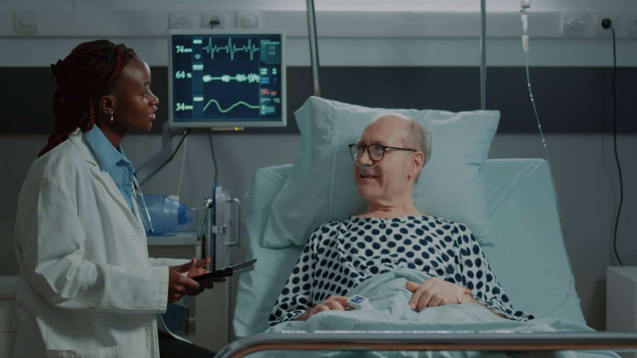 Multi ethnic nurse and doctor looking at tablet for tests