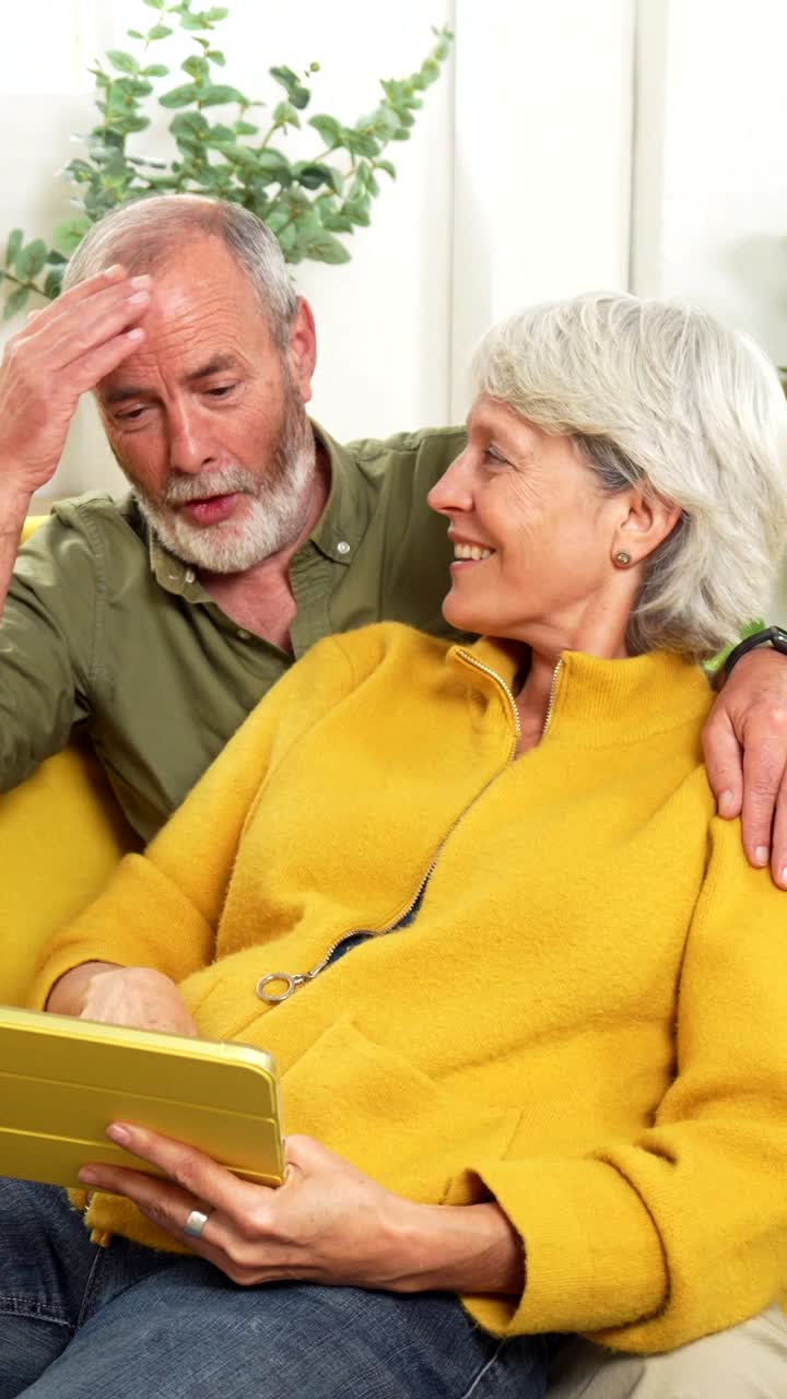 Senior Couple Enjoying Tablet at Home