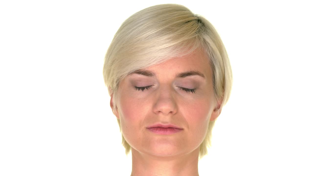 The face of a woman closing her eyes on a perfectly white background