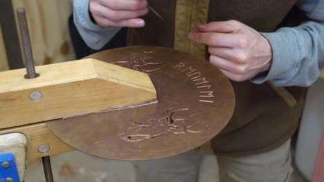 creation of a cover plate for a new handmade musical instrument, a resonator guitar