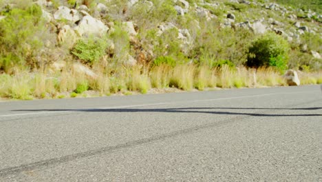 senior woman jogging on a road at countryside 4k