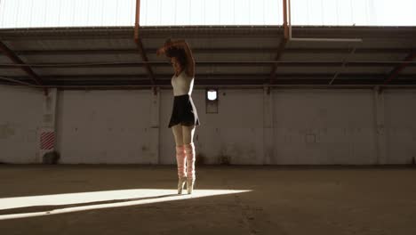 female dancer in an empty warehouse