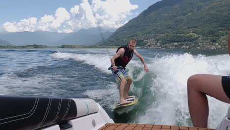 guy wakeboarding on lake maggiore in switzerland