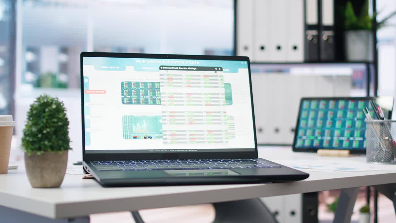 Empty office with stock portfolio on devices screens