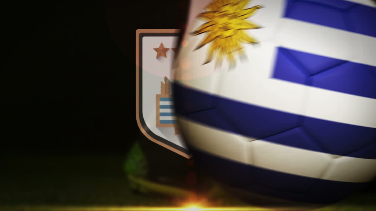 Football player kicking uruguay flag ball