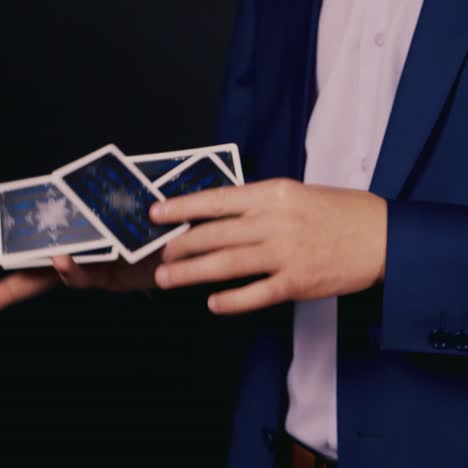 The-magician-does-tricks-with-playing-cards-4