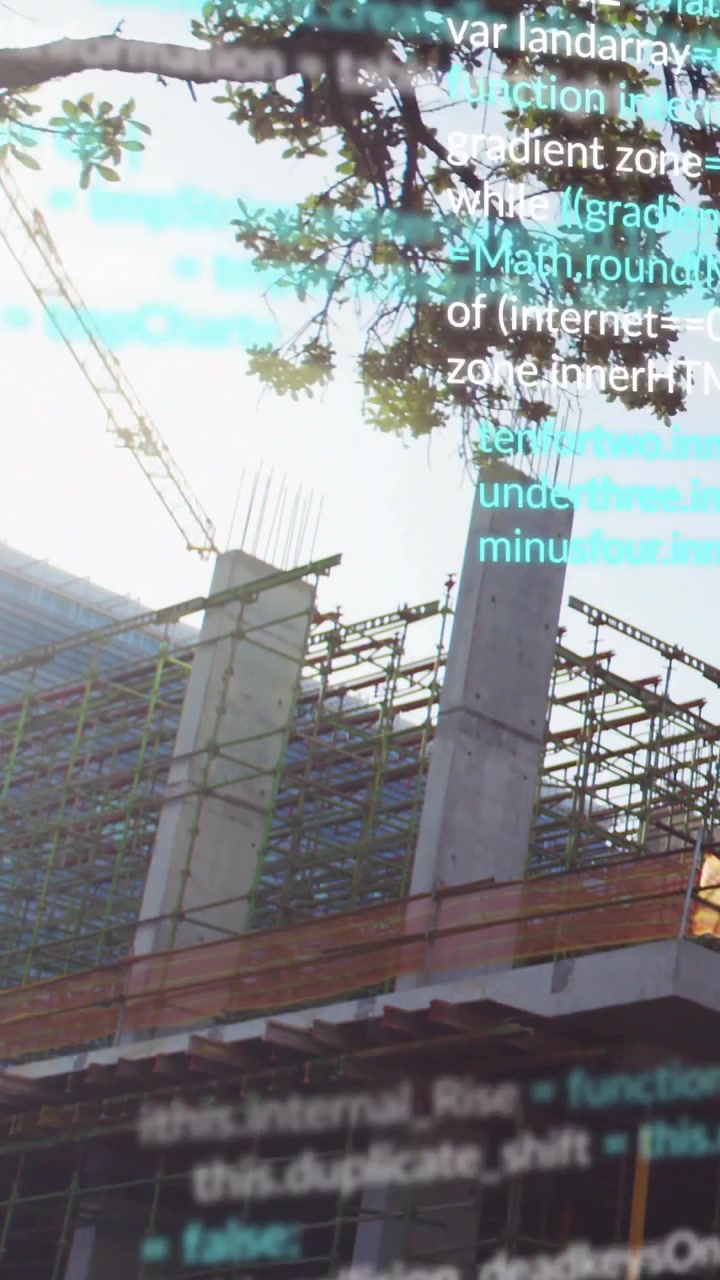 Vertical video: Cyan code overlay appearing moving down over columns, scaffold, crane, showing data