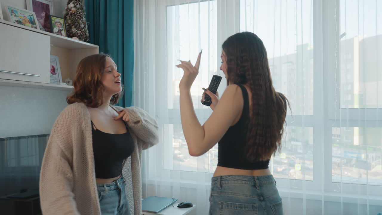 Women Dance Joyfully, Friends Sing And Dance Happily, Bright Apartment Filled With Singing And Dancing Women, Women Wearing Casual Denim Enjoying Energetic Music And Joyful Friendship
