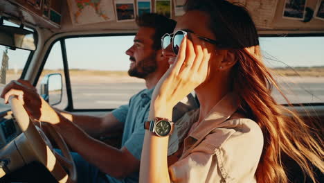 happy couple on a road trip in a vintage car