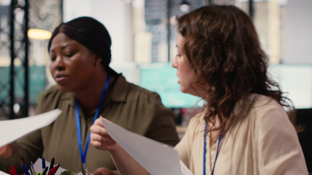 Empowered group of women strategizing together with data reports