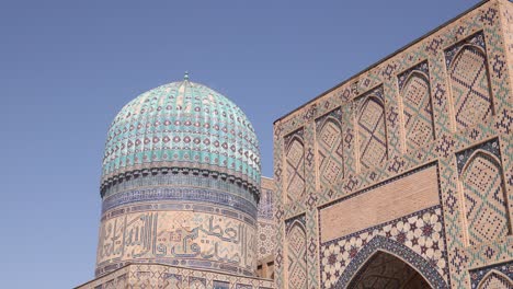 detailed-archway-and-tiling-on-the-front-of-madrassa-and-mosque-in-Samarkand,-Uzbekistan-along-the-historic-Silk-Road