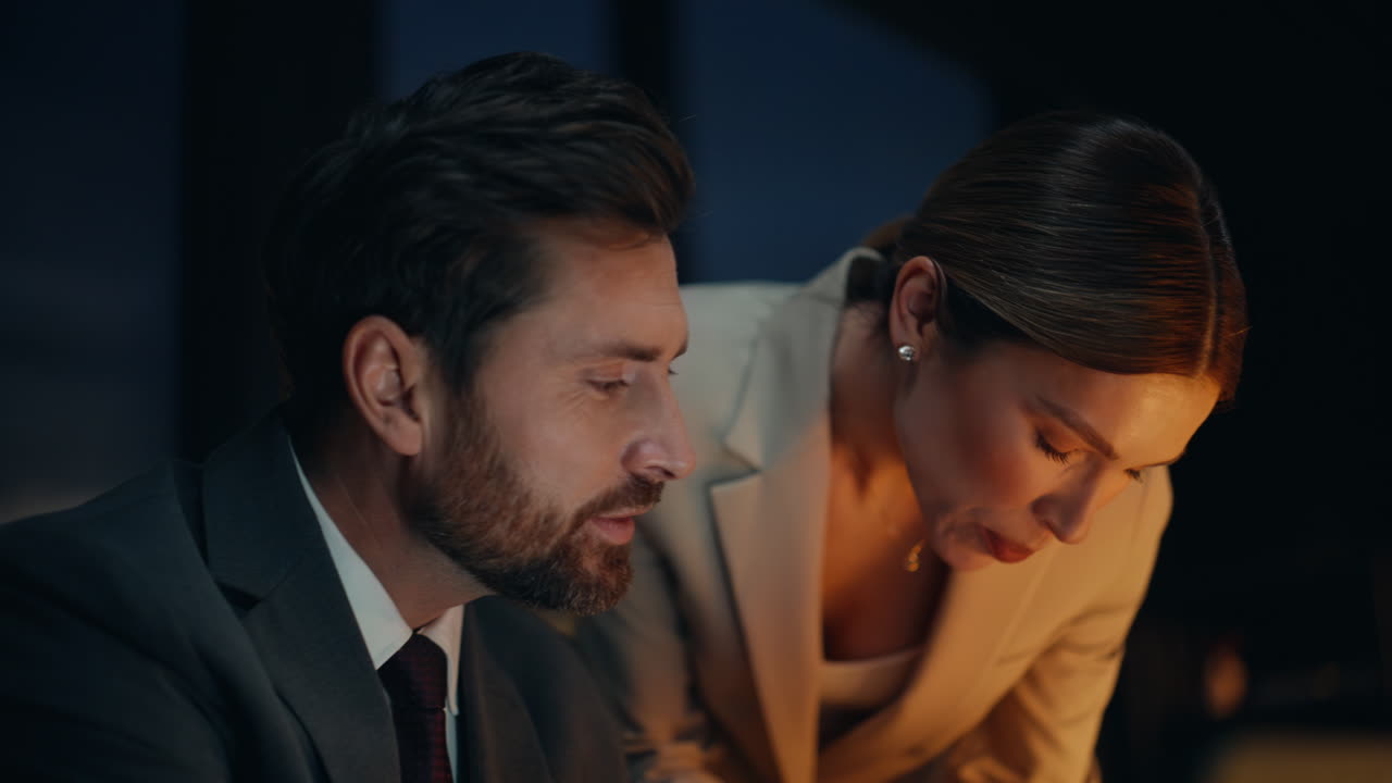 Woman assistant bringing documents for sign to man boss portrait. Business pair