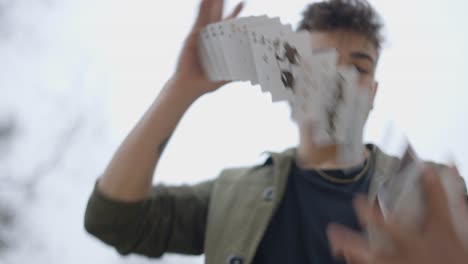 man performing magic card trick
