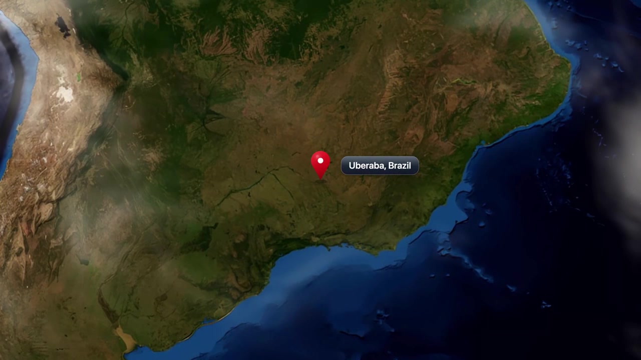 Satellite animation zooms from deep space into South America, pinpointing Uberaba, Brazil. Includes NASA public domain imagery.