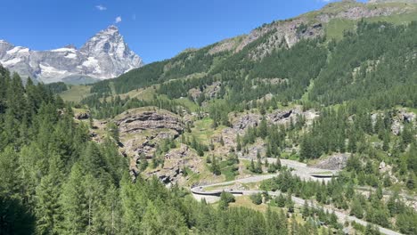 green the cervinia mountain is a green place in summer, for skiing in winter, with snow at the top. it carries feelings of loneliness, love, hate and awe, above all impression, aesthetic experience