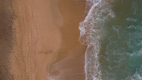 cofete beach, fuerteventura: view from above to the shore of the large beach and the waves crashing hard