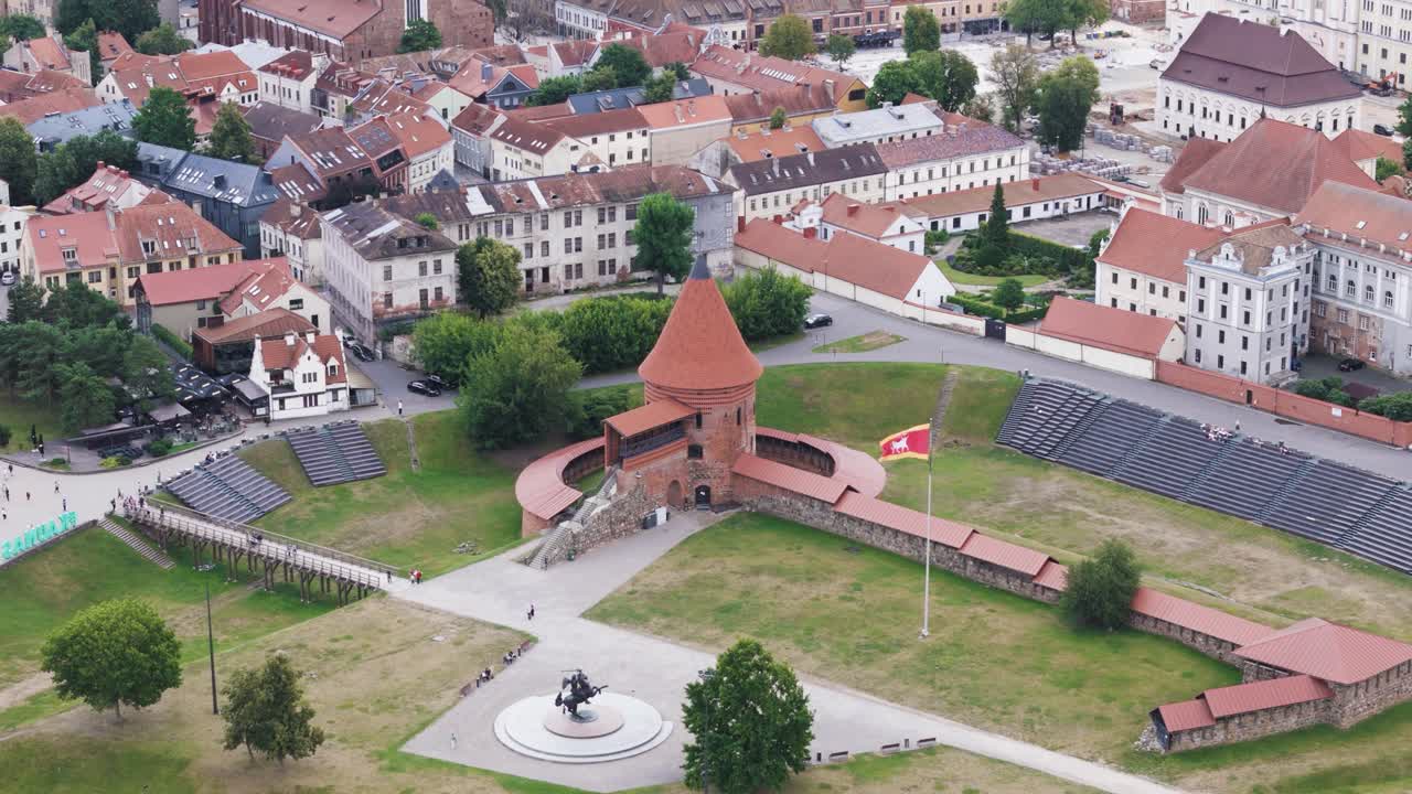 Kaunas Castle and red rooftops of old town buildings, aerial view