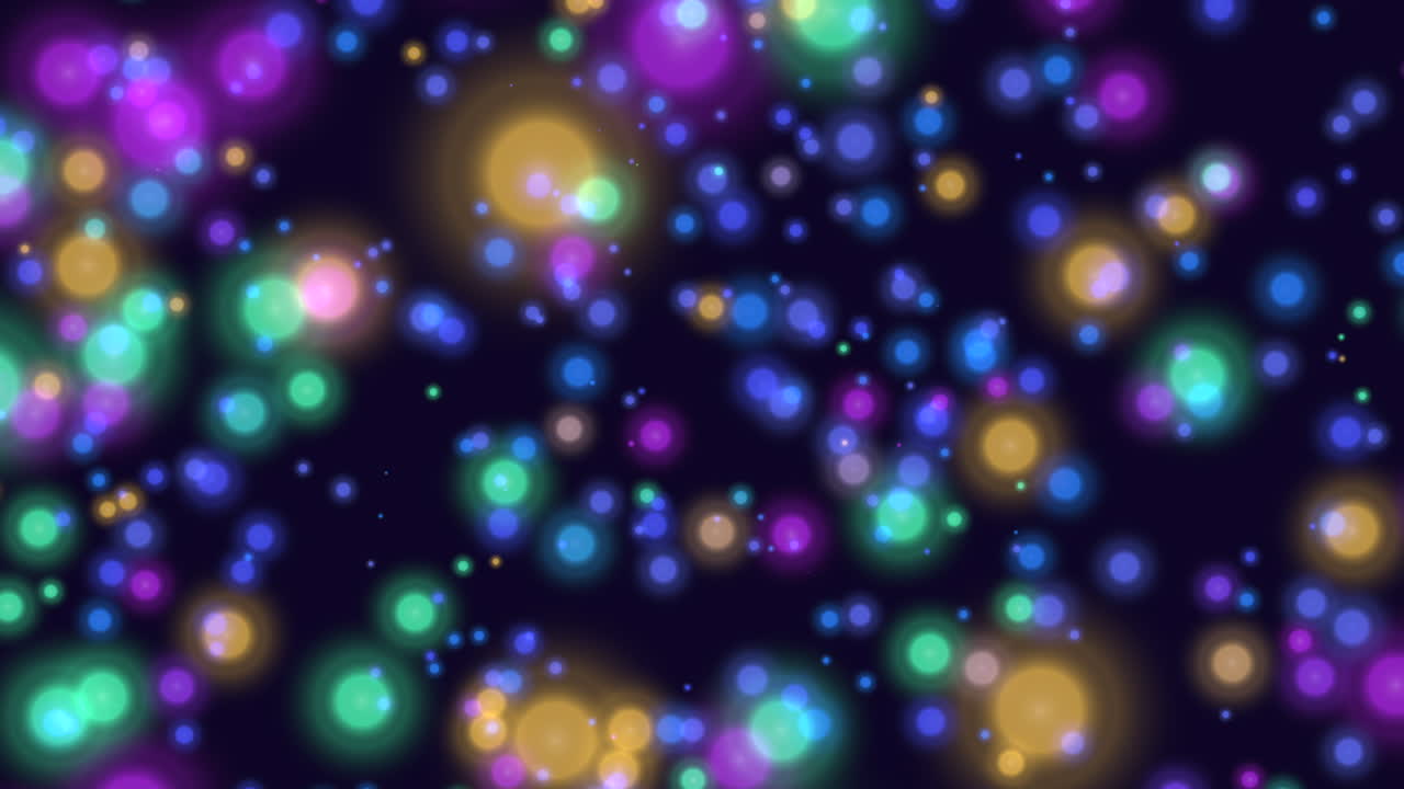 Vibrant circles in assorted colors form a captivating concentric pattern against a sleek black background in this visually striking and dynamic image