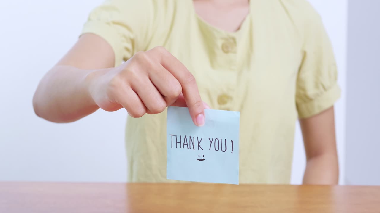 A heartfelt moment capturing appreciation through a simple thank you note