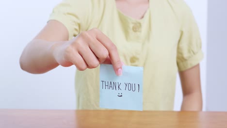 a heartfelt moment capturing appreciation through a simple thank you note