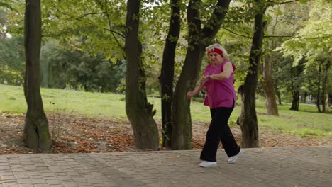 Senior-old-woman-running-in-park-and-using-smart-watch.-Female-runner-working-out-cardio-outdoor