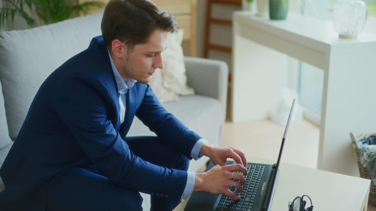 Concentrated Businessman on Laptop