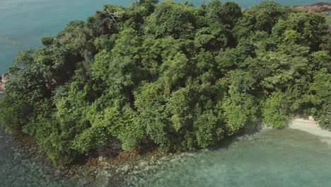 Aerial-trucking-shot-of-a-small-tropical-island-in-Asia